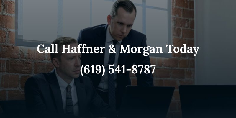 attorneys haffner & morgan looking at a computer with the caption: Call Haffner & Morgan today (619) 541-8787